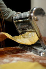 beautiful woman kneading to make pasta