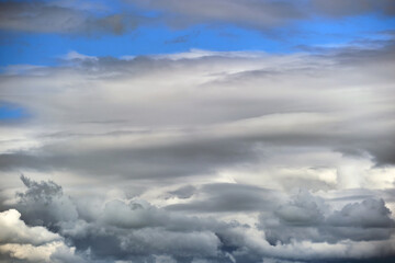 Landscape of dark clouds forming on stormy sky during thunderstorm