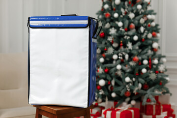 No logo company backpack in front of a christmas tree