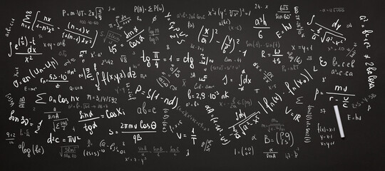 math background, numbers, equations and formulas are written on a black chalkboard with chalk...