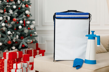 Cleaning company backpack and chemicals christmas advertising photo