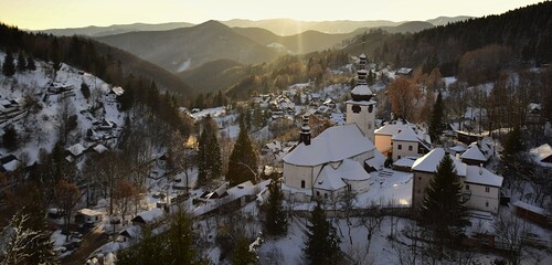 winter village in the valley of the mountains at sunset. Spania dolina in central europe. © elabracho