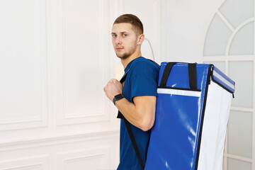 Worker from cleaning service with company backpack