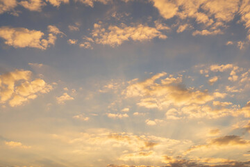 Evening sun with sky with clouds For background. The sun shines violently with clouds, blue sky background.