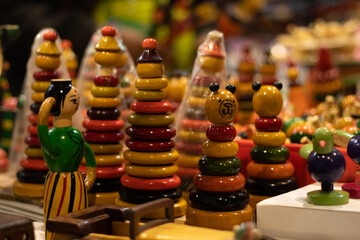 Multicolored Stacking Doll Figure With Various Rings Tapering To Top For New Born Babies Infants Or Kids. Eco Friendly Wooden Handmade Wooden Channapatna Ring Toys Originating From Karnataka, India