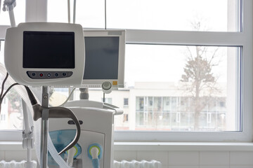 Video laryngoscope , on background medical ventilator in ICU in hospital.