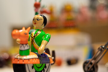 Multicolored Traditional Cultural Indian Girl Or Woman Riding Horse. Toy For New Born Babies Infants Or Kids. Eco Friendly Colorful Handmade Wooden Channapatna Ring Toys Originating From Karnataka