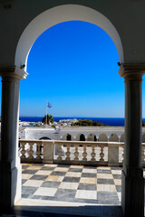 forecourt of the superb Panaghia Evangelistria cathedral overlooking Tinos, famous Cyclades island, in the heart of the Aegean Sea © Mariedofra