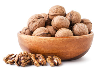 Whole walnut in a plate on a white background. Isolated
