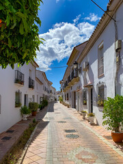 Fototapeta na wymiar Benalmadena Old Town street, Spanish Traditional balconies with flowers