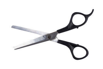 Barber filing scissors close up on white, isolated.