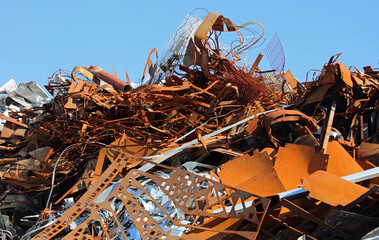 pile of rusty ferrous scrap in a landfill of a foundry