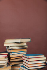 Stacks of Books for College Library Training Brown Background