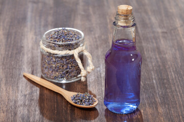 Lavandula Angustifolia - Lavender Essential Oil Glass Bottle With Dried Lavender Flowers