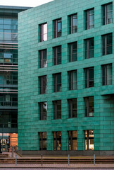 Fototapeta na wymiar modern green building with windows