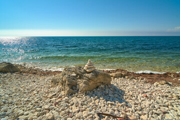 The sun. Stones. Sand. Sea. Summer.