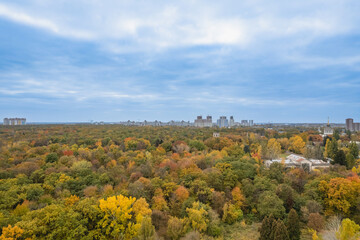 Fototapeta na wymiar Aerial view of modern city with autumn park
