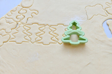 Green herringbone shape for baking cookies from rolled dough.