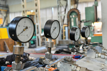 High pressure gauges with changeover valves in the hydraulic supply system.