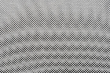 Black blank background for design or text insertion, corrugated rubber surface.