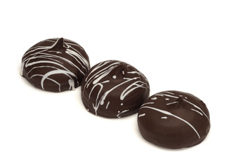 Soft meringue cookies in chocolate on white background
