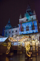 Obraz premium Beautiful Christmas decorations at famous main square Hauptplatz, at night, in the city center of Graz, Steiermark, Austria.