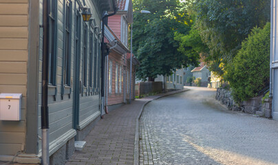 Street with wooden old houses in the historical center of Kungälv, Sweden
