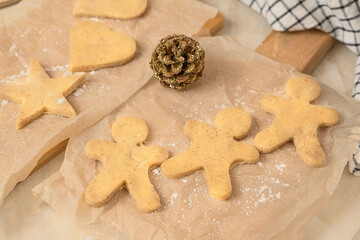 the process of making gingerbread men cookies , christmas cookies