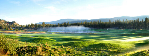 Morning mist over a pod at a golf course in the Okanagan Valley of British Columbia Canada
