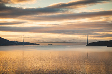 Beautiful dramatic sunset overlooking Lake Rombaken and the Halogaland Bridge that connects Narvik to the rest of Norway. Northern Norway under the last rays of light