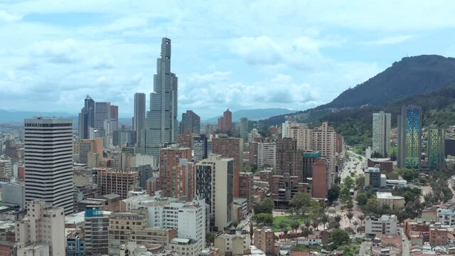 Drone view of Bogota Skyline with blue cloudy sky.