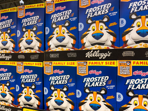 ATLANTA, GEORGIA - DECEMBER 14, 2021 : Kellogg's Frosted Flakes cereal boxes on shelf at an American grocery store supermarket.