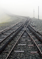 Railway lines in the fog going up mount snowdon