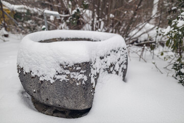 Snow covered stone basin