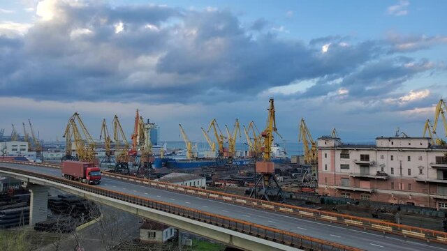 Industrial port landscape with red container truck