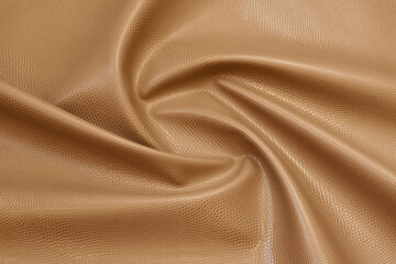 beige artificial leather with waves and folds on PVC base