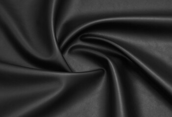 black artificial leather with waves and folds on PVC base