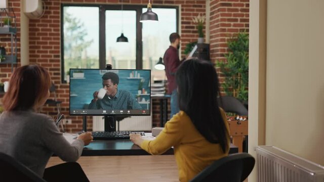 Business women meeting with candidate on remote video call, attending online job interview to fill vacancy. Coworkers using videoconference to talk to applicant about company career.