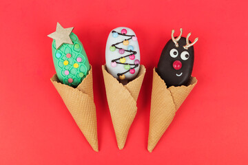 Set of different Christmas cookies donats and cakesicles on red background. Christmas decorations.