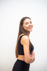 Fototapeta premium High fashion portrait of young fit elegant woman wearing black clothes. 
