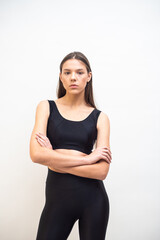 High fashion portrait of young fit elegant woman wearing black clothes. 