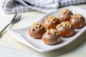Traditional delicious Turkish dessert; Tahini and hazelnuts on Kemalpasa dessert