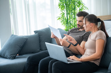 Obraz premium woman and man couple working online with laptop for business work at home, happy indoor lifestyle