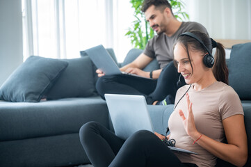 Obraz premium woman and man couple working online with laptop for business work at home, happy indoor lifestyle