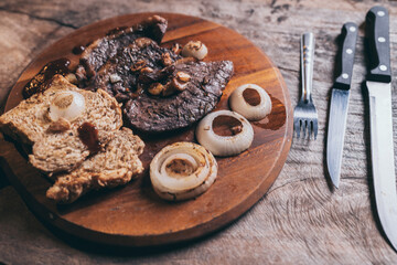 bbq beef steak with onion and pepper, grilled meat with salt and rosemary, beefsteak