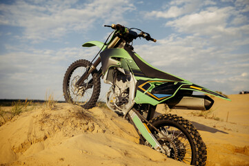 Motorcycle parked in dune prepared for motocross