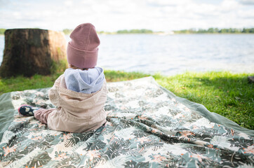 Baby girl enjoying the picking at the lake © Justyna