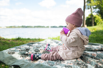 Baby girl enjoying the picking at the lake © Justyna