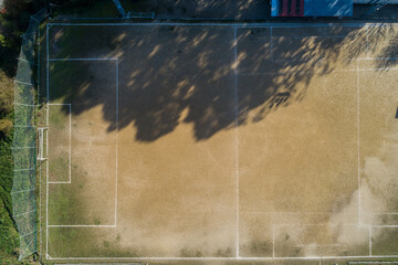 Overhead drone photo of an earthen football field