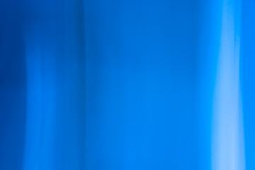 Abstract background banner in blue tones with shadows, glare, vertical lines, waves.